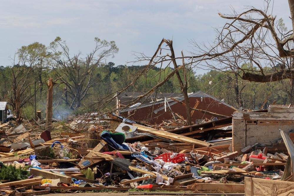 A neighborhood has been severely damaged by a strong storm. The early summer storm season in the U.S. is causing devastating losses.